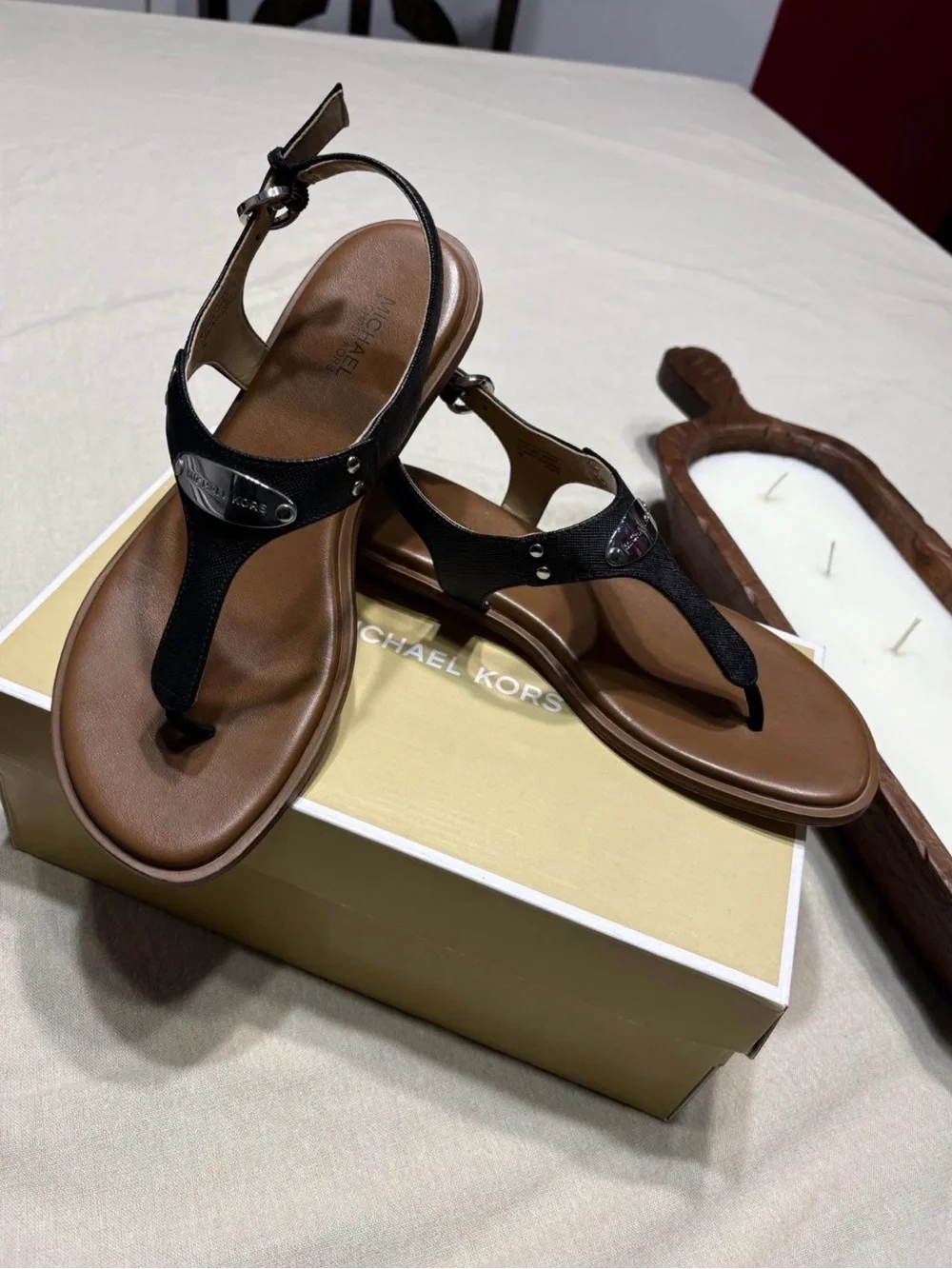 Michael Kors Black and Brown T-Strap Sandals with Logo Plate